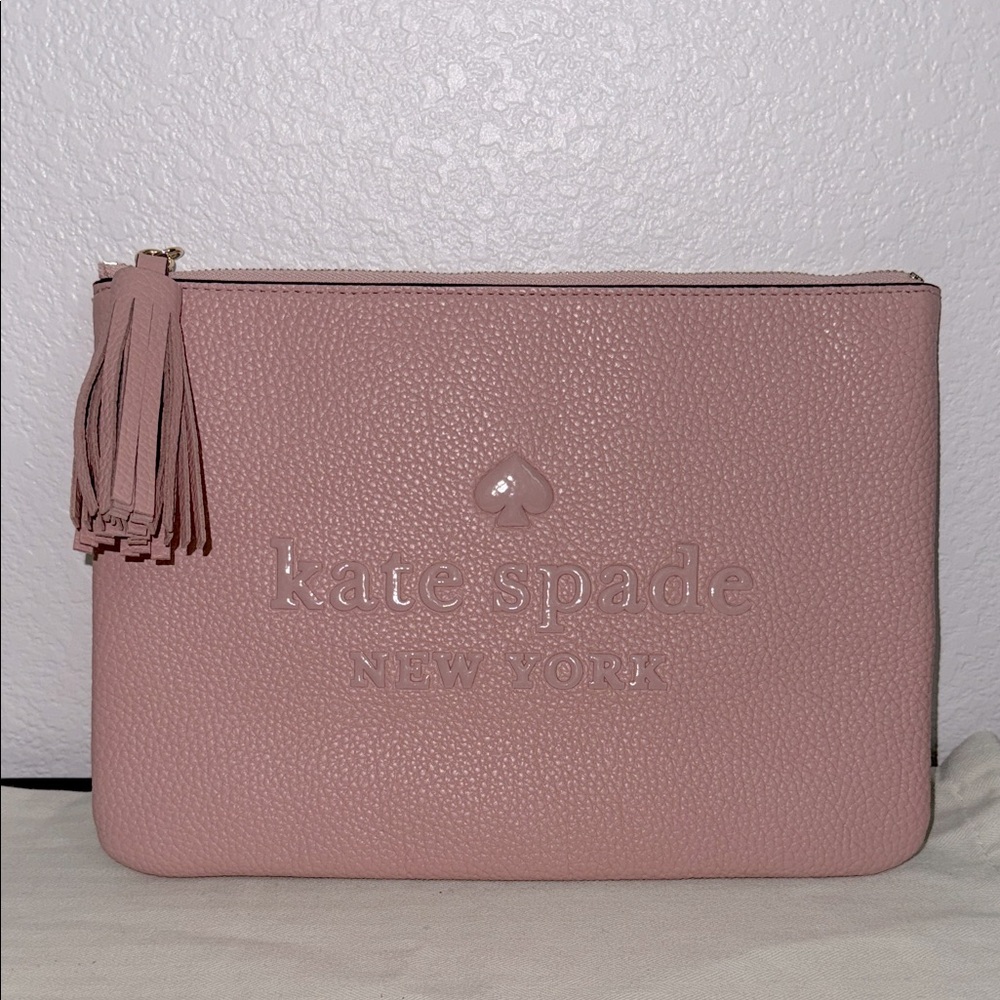 Kate Spade large pink tassel pouch.